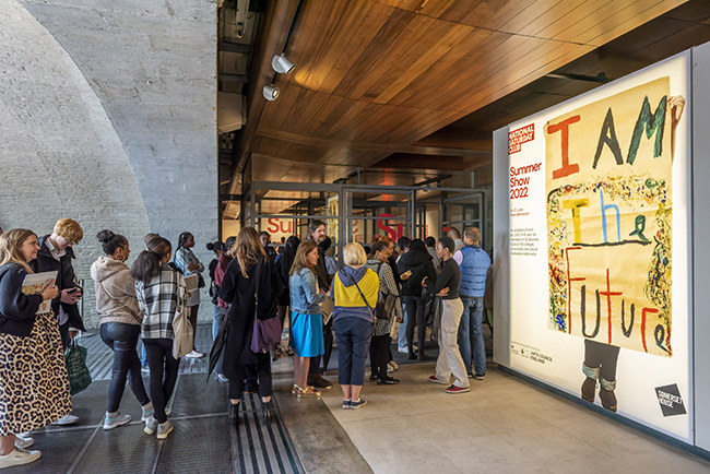 A queue of visitors wait to enter the National Saturday Club Summer Show in 2022 at Somerset House